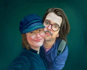 Portrait painting of a couple on a green back ground. The woman has short brown hair and wearing a blue hat and blue shirt with gold glasses. The man has long brown hair and is wearing a light blue shirt with brown glasses.